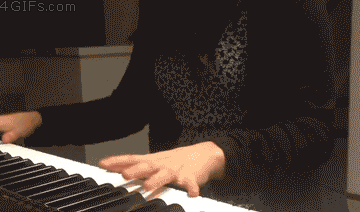 cat_interrupts_girls_piano_playing.gif