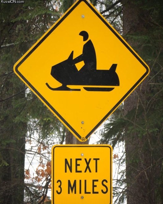 caution_pac_man_driving_snowmobile_next_3_miles.jpg