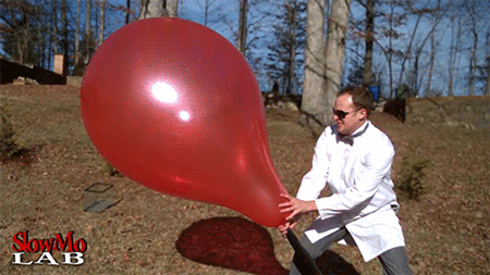 giant_balloon_popping_in_slow_motion.gif