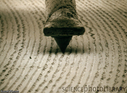 just_a_view_from_an_electron_microscope_of_a_record_stylus_on_the_grooves_of_an_lp.jpeg