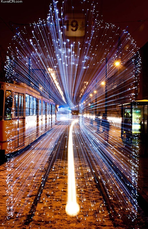 long_exposure_of_a_departing_tram_in_budapest_covered_in_30000_led_lights.jpg