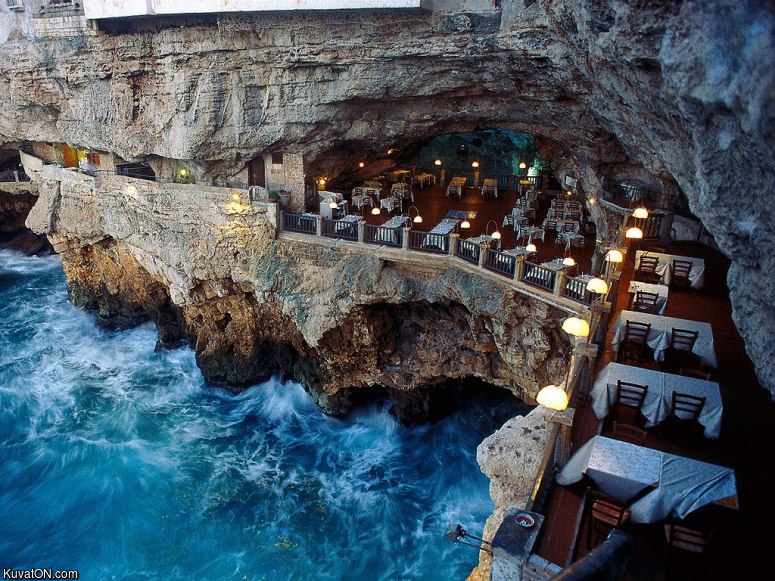 oceanside_restaurant_built_into_a_grotto_in_italy.jpg