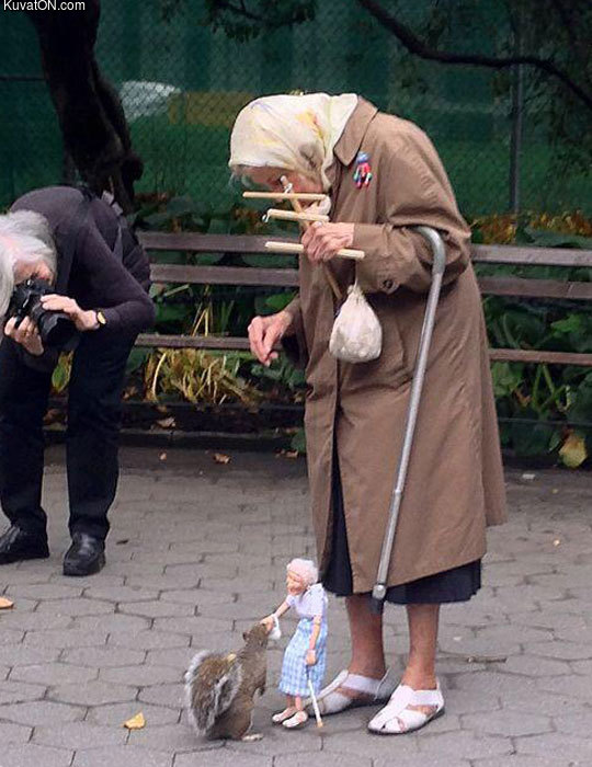 old_lady_playing_with_squirrel.jpg