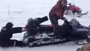 russian_man_gets_sucked_into_snowmobile.gif