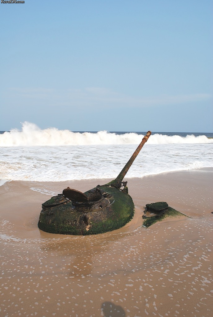 tank_buried_in_sand_remnants_of_the_angolan_civil_war_soyo_zaire_province_angola.jpg